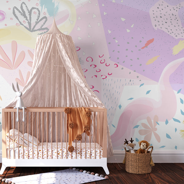 Soft pastel abstract floral peel-and-stick removable wallpaper in a girl's nursery featuring a wooden crib, pink canopy, and cozy decor.