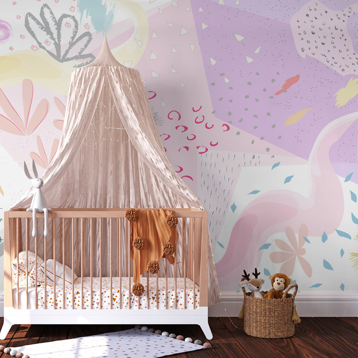 Soft pastel abstract floral peel-and-stick removable wallpaper in a girl's nursery featuring a wooden crib, pink canopy, and cozy decor.